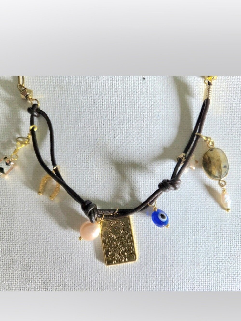 Gold-Plate Charm Necklace with Blue Eye and Pink Pearl on Brown Cord